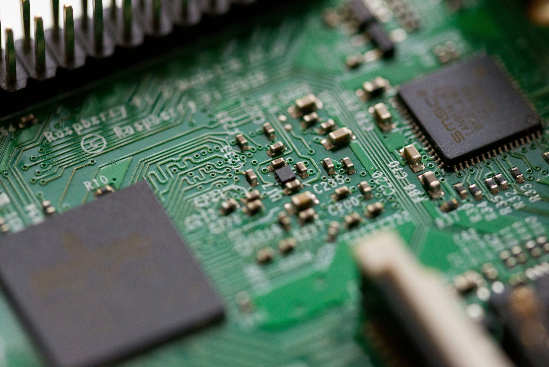 Close-up view of detailed green circuit board.